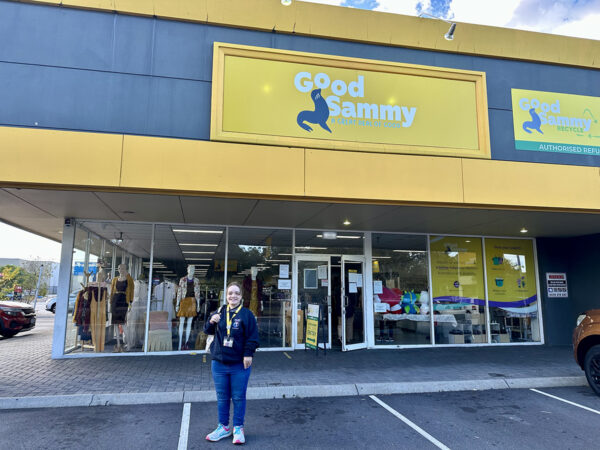 Jade standing in front of a Good Sammy store.